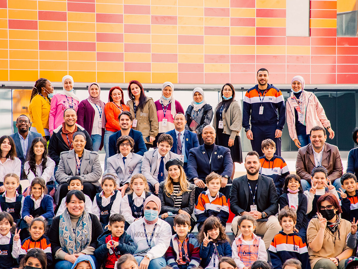 ISK students and teachers assembled in the atrium area